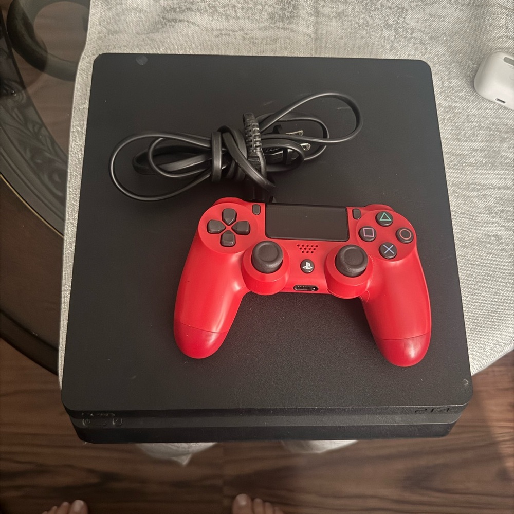 PS4 slim Sony Black and Red Console with DualShock 4.